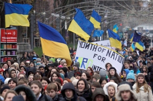 Ukrainian students from different educational institutions shout slogans during their march in Kiev, Ukraine, 26 November 2013. More two thousands students gathered for support of Ukrainian Euro integration in downtown capital as they declared a strike. EPA/SERGEY DOLZHENKO